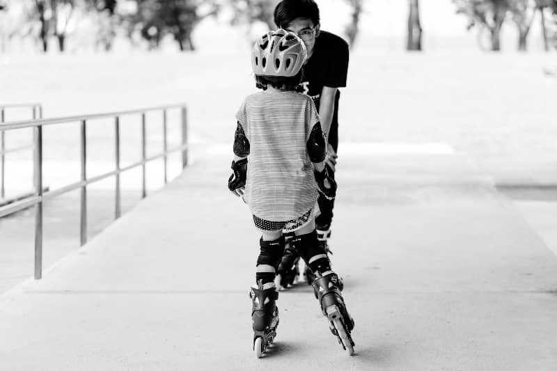 Skating teacher and student | How to Make Money Coaching Youth Sports