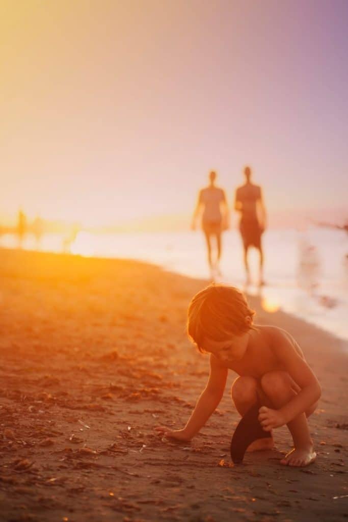 Little Boy Playing the sand at Sunset | My Husband Is a Coach and I Hate It. But Is All Hope Lost?