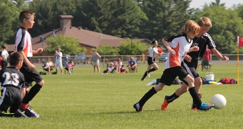 Kids playing soccer | Why Coaches Should Encourage Parents to Attend Sports Practice