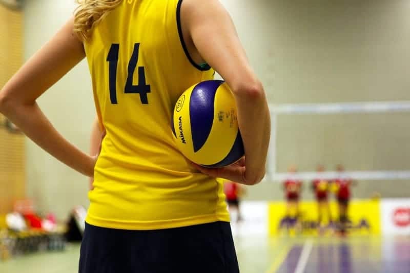 Volleyball captain holding ball | How to Become a Youth Volleyball Coach