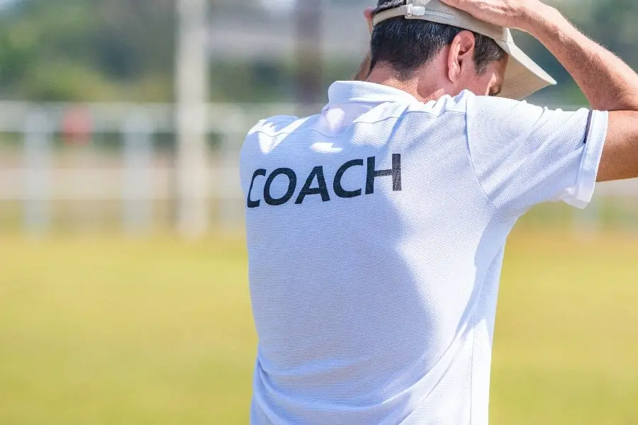 Coach with hands on his head | When to Quit Coaching Sports?