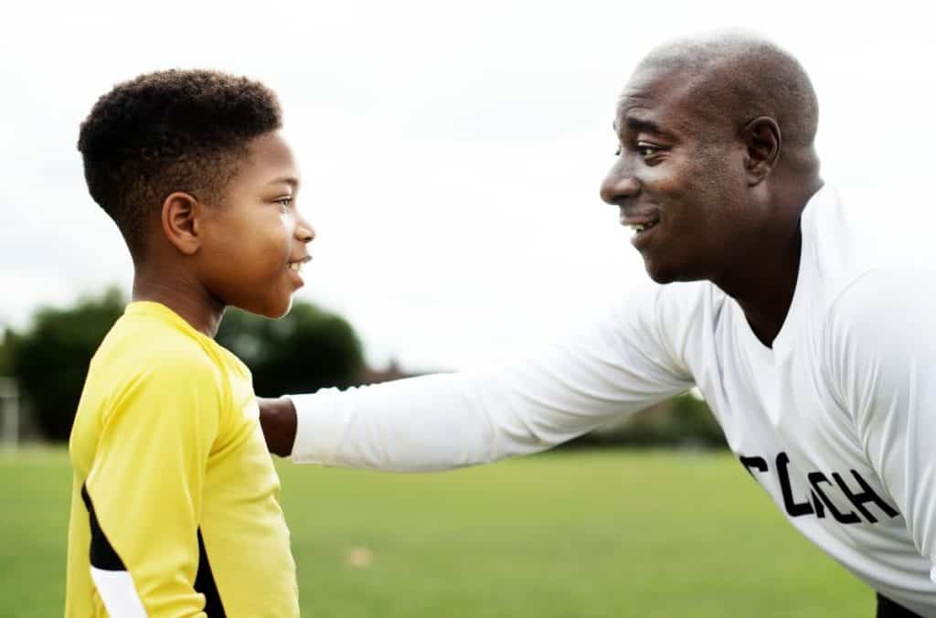Coach talking to athlete | The Best Way Coaches Should Communicate With Athletes