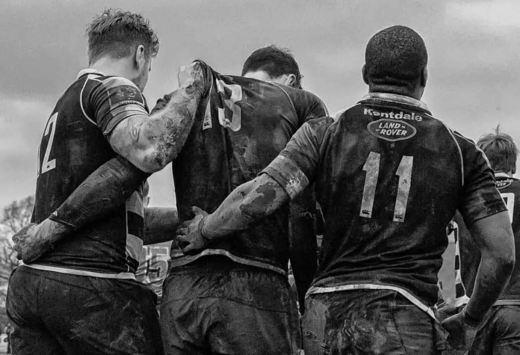 Muddy male athletes | The Complete Coaches Guide to Building Team Culture In Sport
