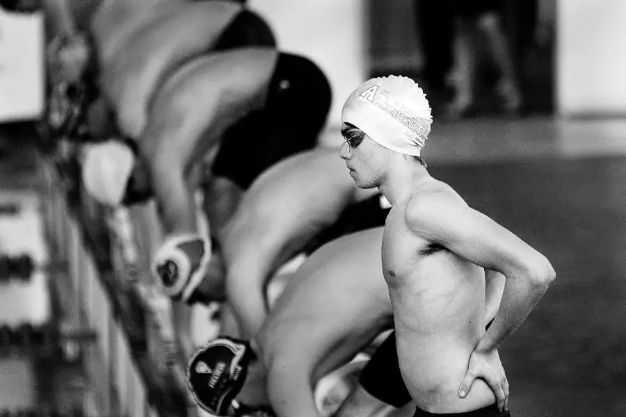 Black and white swimmer on the blocks | Should There Be Equal Playing Time in Youth Sports?