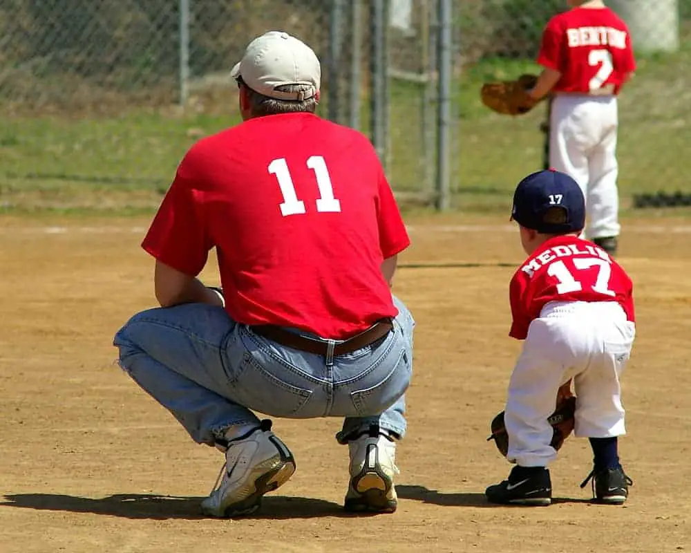 Baseball coach and young baseball player