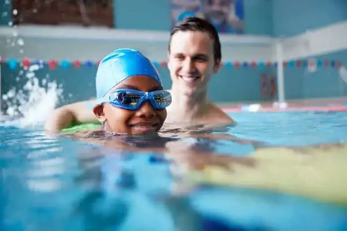 Boys smiling whilst swimming